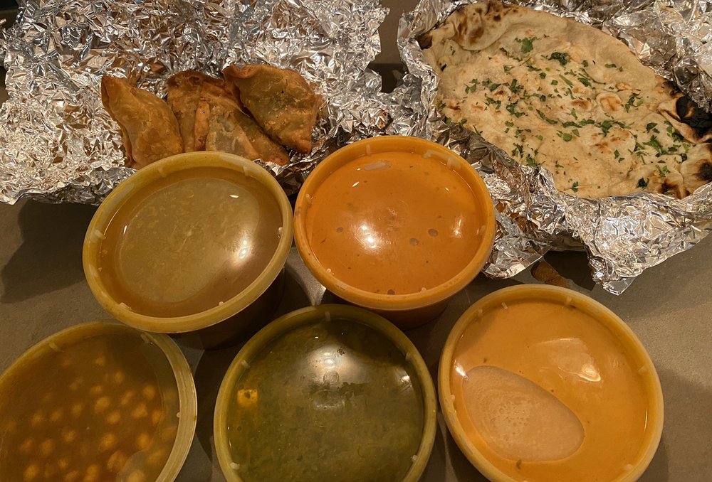 Vegetarian platter, lamb curry, butter chicken, samosas, garlic naan